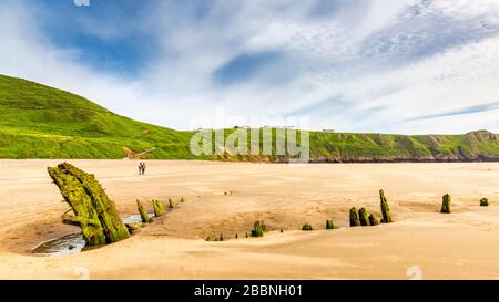 The oak carcass of the Helvetia shipwreck on Rhossili Beach on the Gower Peninsula, Wales Stock Photo