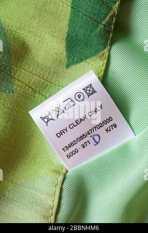 dry clean only label with wash care symbols in woman's clothing Stock