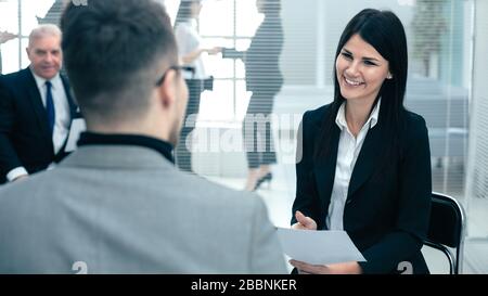 business woman discussing something with a colleague before a business meeting Stock Photo