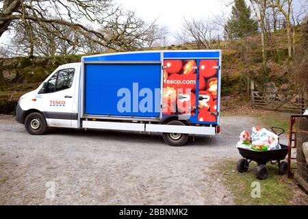 Tesco supermarket van delivering groceries to a customer home in rural Wales during the Coronavirus outbreak Covid-19 pandemic Wales UK  spring  2020 Stock Photo