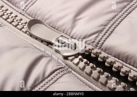 Gray plastic zipper on closes Stock Photo