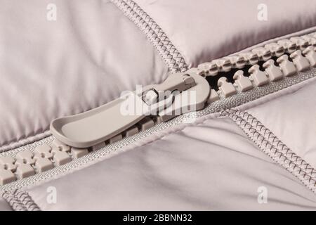 Gray plastic zipper on closes Stock Photo
