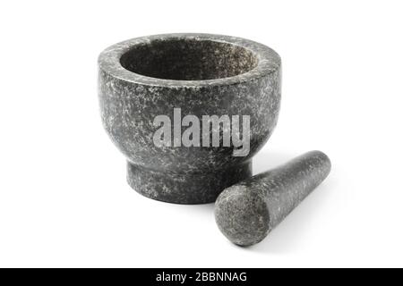 Black stone mortar for grinding seasoning isolated on white Stock Photo