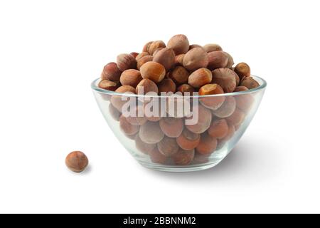 Hazelnuts in a glass cup isolated on white Stock Photo