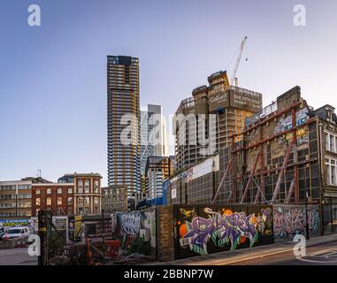 Street art and skyscrapers in Shoreditch, London Stock Photo