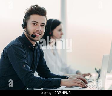 professional call center operators communicate with customers. Stock Photo