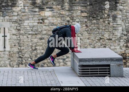London, UK. 01st Apr, 2020. The Tower of London is very quiet apart for a lone person using it for their excercise routine - The 'lockdown' continues for the Coronavirus (Covid 19) outbreak in London. Credit: Guy Bell/Alamy Live News Stock Photo