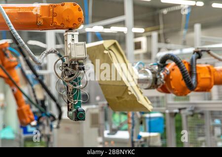 use of robotic arms in the production of cars in the automotive industry Stock Photo