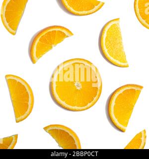 Fruit pattern of orange slices isolated on white background. Fruit composition. Top view. Flat lay. Stock Photo