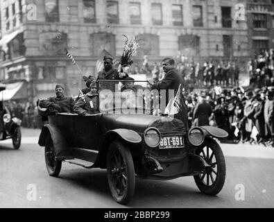 Sgt. Henry Johnson waves to well-wishers during the 369th Infantry Regiment march up Fifth Avenue in New York City on Feb. 17, 1919 during a parade held to welcome the New York National Guard unit home. Johnson was the first American to win the French military's highest honor during World War I.More than 2,000 Soldiers took part in the parade up Fifth Avenue. The Soldiers marched seven miles from downtown Manhattan to Harlem. ( National Archives) Stock Photo