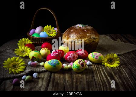 Easter composition with traditional Russian Easter bread kulich. Hand painting Easter eggs. The concept of religious holidays, family traditions. Sele Stock Photo