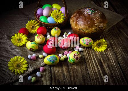 Easter composition with traditional Russian Easter bread kulich. Hand painting Easter eggs. The concept of religious holidays, family traditions. Sele Stock Photo