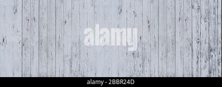 Light gray painted, partly heavily weathered wooden wall Stock Photo