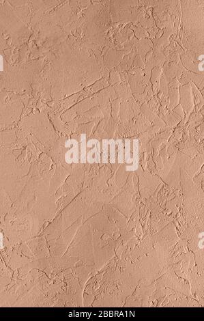 Abstract concrete wall texture for background. Color peach gelato. Copy space. Close up. Stock Photo