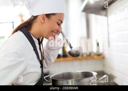 Female chef in kitchen Stock Photo
