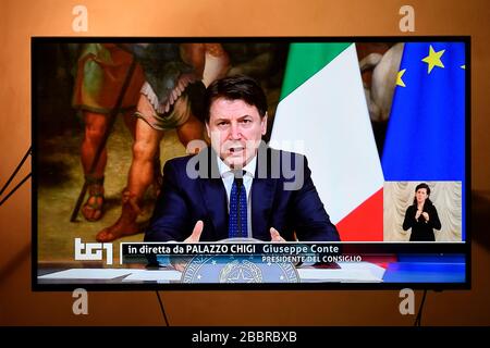 Turin, Italy. 01st Apr, 2020. TURIN, ITALY - April 01, 2020: Italian Prime Minister Giuseppe Conte, broadcasted on television by channel RAI 1, announces the extension of the restrictions until April 13th to contain crisis caused by the coronavirus. The Italian government imposed unprecedented restrictions to halt the spread of COVID-19 coronavirus outbreak, among other measures people movements are allowed only for work, for buying essential goods and for health reasons. (Photo by Nicolò Campo/Sipa USA) Credit: Sipa USA/Alamy Live News Stock Photo