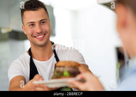 Professional chef in industrial kitchen Stock Photo