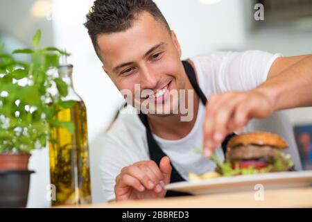 Professional chef in industrial kitchen Stock Photo
