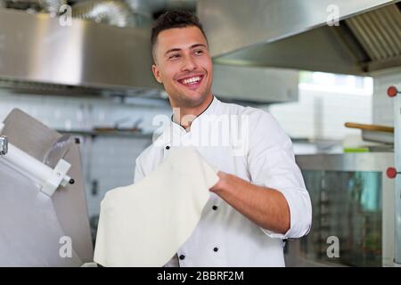 Professional chef in industrial kitchen Stock Photo