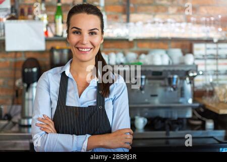 Woman working at cafe Stock Photo