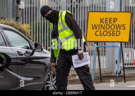 NHS workers queue up in vehicles to get tested for COVID-19 at newly opened test centre located at IKEA car park in Wembley, North-west London, UK Stock Photo