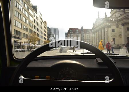 Steering wheel inside of Trabant 601 green vintage car street view