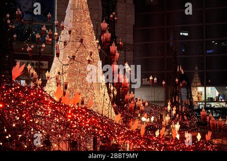 Christmas tree and many different lights in background Stock Photo