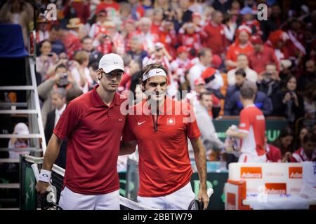 NOVI SAD - JANUARY 31: ROGER FEDERER of Switzerland and Ilija Bozoljac of Serbia during the Davis Cup match between Serbia and Switzerland, January 31 Stock Photo