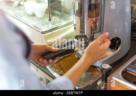 Female barista making coffee Stock Photo