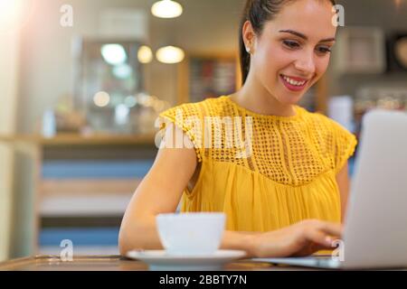 Young businesswoman working at cafe Stock Photo