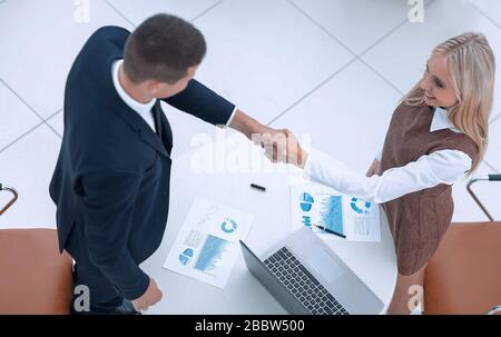 handshake colleagues after drawing up a new financial plan Stock Photo