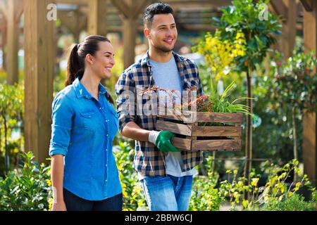 Smiling employees in garden center Stock Photo