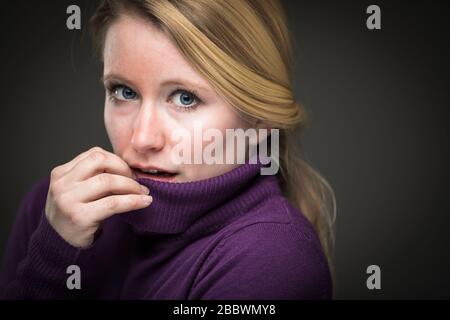 Fear/anxiety/regret/uncertainty in a young woman - effects of a difficult life situation - virus pandemic/confinement concept Stock Photo