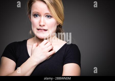 Remorse/Regrets/Fear/Anxiety/Uncertainty in a young woman - effects of a difficult life situation - vivid emotions concept Stock Photo