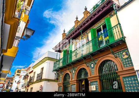 Facade of the Alfarería 21 restaurant in restored Ceramica Artistica, M G Montalvan building in Triana, Calle Alfareria, Seville, Andalusia, Spain Stock Photo