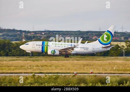 Plane landing at an airport Stock Photo