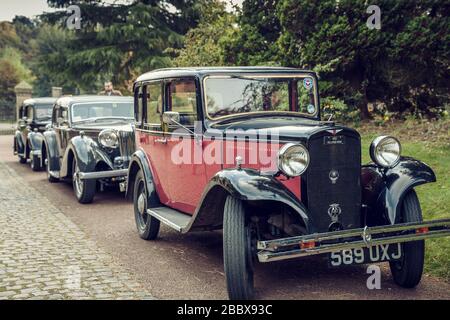 A line of vintage motor cars headed by a 1932 Hillman Minx 589 UXJ, Papplewick Pumping Station 1940's event, England Stock Photo