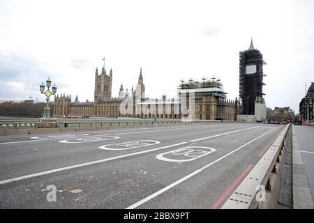 London, UK. 01st Apr, 2020. Day Nine of Lockdown in London. Westminster Bridge is almost empty whilst the country is on lockdown due to the COVID-19 Coronavirus pandemic. People are not allowed to leave home except for minimal food shopping, medical treatment, exercise - once a day, and essential work. COVID-19 Coronavirus lockdown, London, UK, on April 1, 2020 Credit: Paul Marriott/Alamy Live News Stock Photo