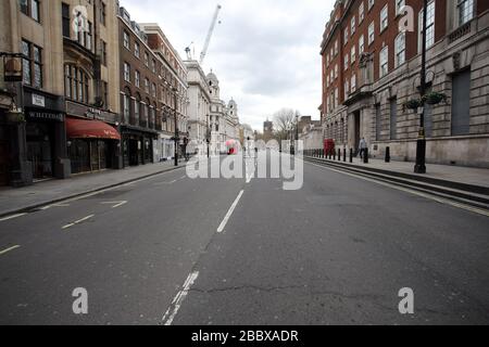 London, UK. 01st Apr, 2020. Day Nine of Lockdown in London. An almost deserted Whitehall at 12.20pm as the country is on lockdown due to the COVID-19 Coronavirus pandemic. People are not allowed to leave home except for minimal food shopping, medical treatment, exercise - once a day, and essential work. COVID-19 Coronavirus lockdown, London, UK, on April 1, 2020 Credit: Paul Marriott/Alamy Live News