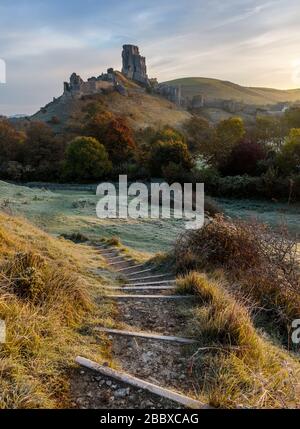 Sunrise on a frosty November morning at Corfe Castle in Dorset, England Stock Photo