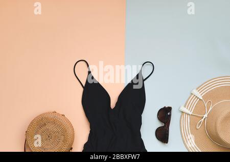 Swimming suit with sunglasses and straw hat for summer. Flatlay Stock Photo