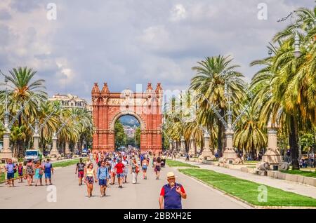 Promenade Passeig de Lluis Companys and the Arc de Triomf - a triumphal arch in the city of Barcelona in Catalonia, Spain. Stock Photo