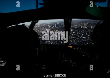 Officers with the U.S. Customs and Border Protection Air and Marine Operations fly an A-Star helicopter over downtown Houston, Texas, Jan. 30, 2017. The U.S. Customs and Border Protection is providing security for Super Bowl 51. Stock Photo