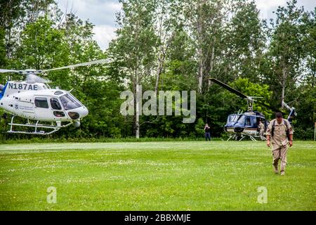 An OAM AS-350 takes off from the landing zone in Dannemora NY, on June 18, 2015. Stock Photo