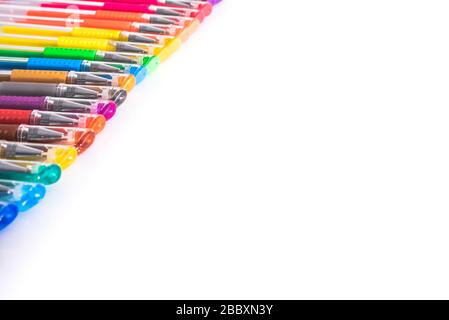 Set of colored pens arranged on a white studio table with isolated copy space. Stock Photo