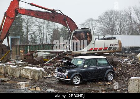 Customs and Border Protection in conjunction with British Authorities destroys a Mini Cooper that had many violations related to importation. Stock Photo