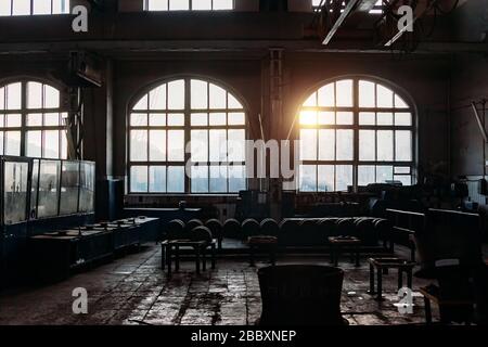 Old abandoned railroad workshop. Train repairing factory with old machinery. Stock Photo