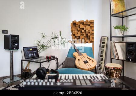 Professional digital studio at home for recording. He has instruments and  midi controller. Music production concept Stock Photo - Alamy