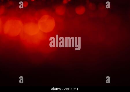 Red abstract background with bokeh defocused lights. Stock Photo