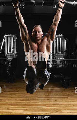 Strong Man Doing L-Sit Pull Ups in Gym, Sports Stock Footage ft. man & gym  - Envato Elements